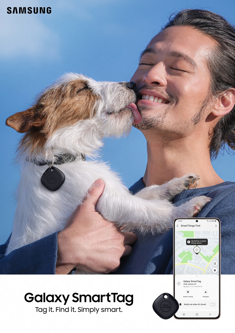 Dog with SmartTag dongle attached to collar licking man's face with UI of SmartTag visible in smartphone to the left