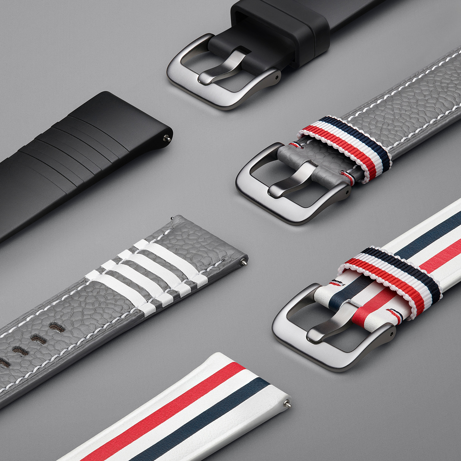 Watch bands designed by Thom Browne for the Galaxy Watch3. Close shot.